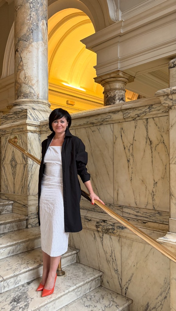 Portrait on marble stairs in a museum